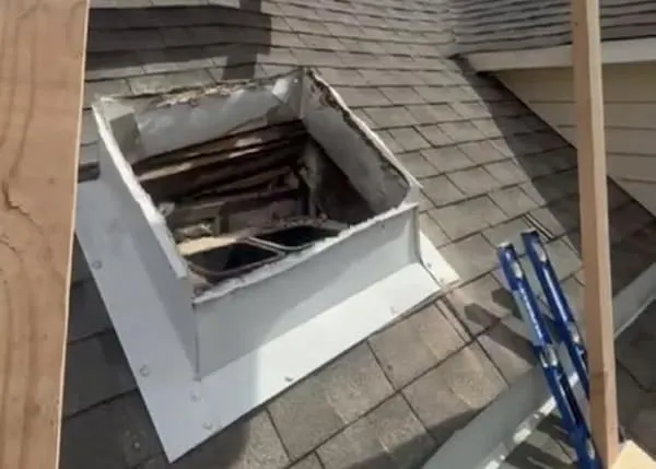 Chalfont PA chimney showing severely eroded mortar joints and cracked chimney cap before tuckpointing