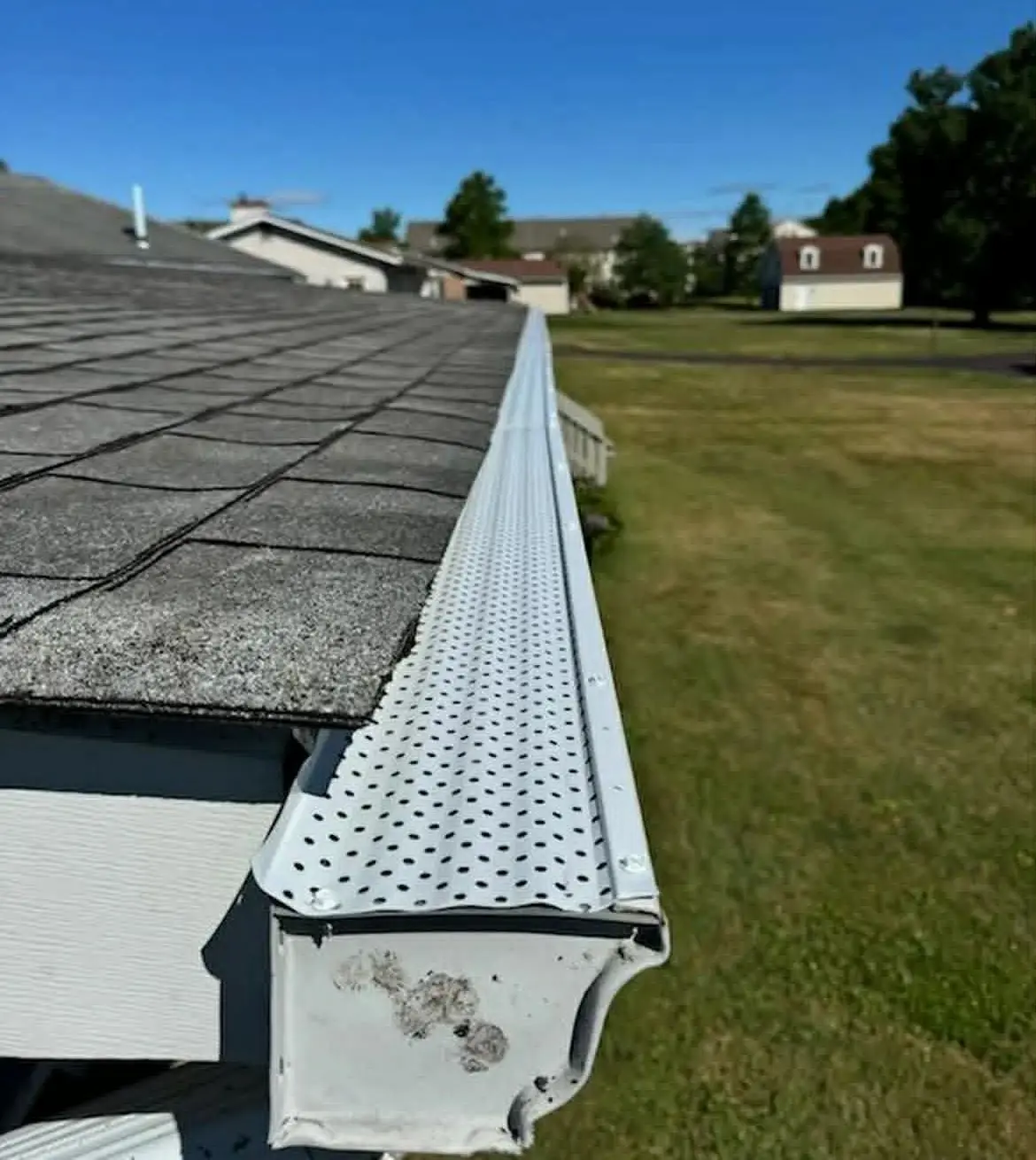 Seamless aluminum gutter installation with gutter guards in Bucks County PA