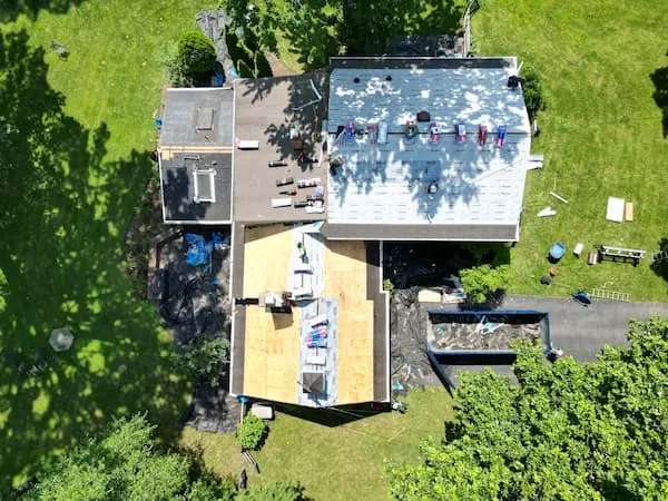 Aging 3-tab asphalt shingle roof on a Lansdale PA cape cod showing cracking and tab deterioration before replacement