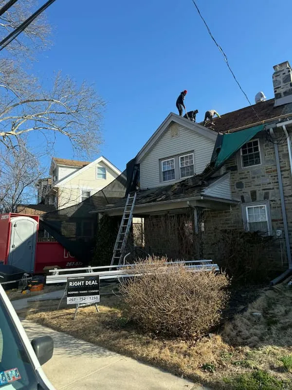 Failed modified bitumen flat roof on a Hatboro PA colonial addition showing ponding water and patch repairs before replacement